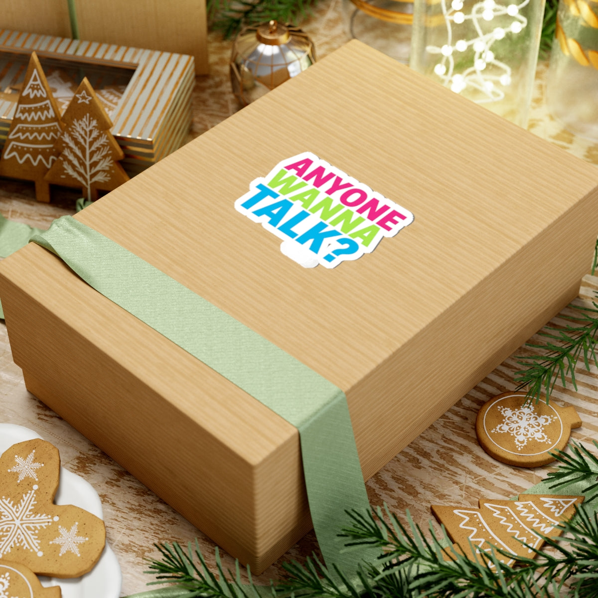 Anyone Wanna Talk? sticker applied to a kraft shipping box in an outdoor setting — JLR© Investigates