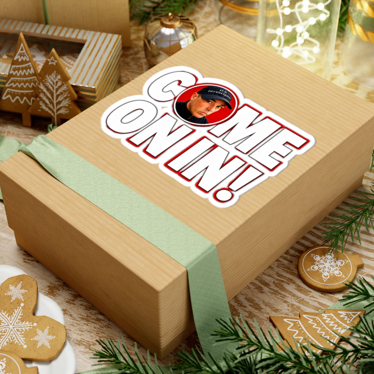 Come On In! sticker on a gift box with festive holiday decorations in the background