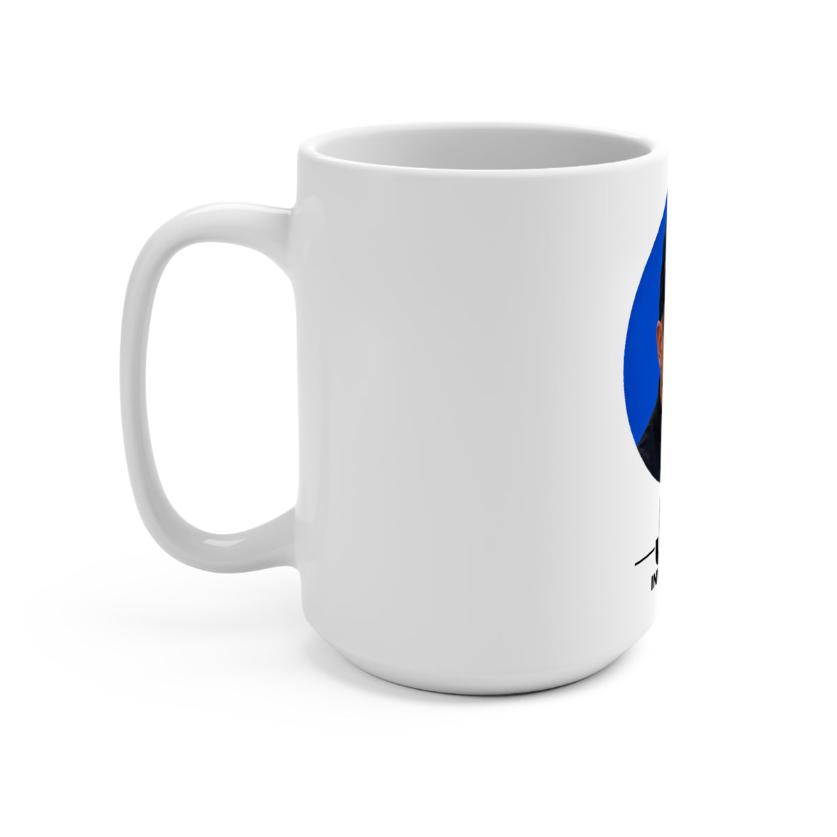 Angled view of a white 15 oz JLR© Investigates photo mug with the blue portrait graphic and handle