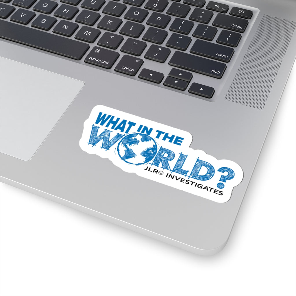 What In The World? JLR© Investigates sticker on silver laptop keyboard