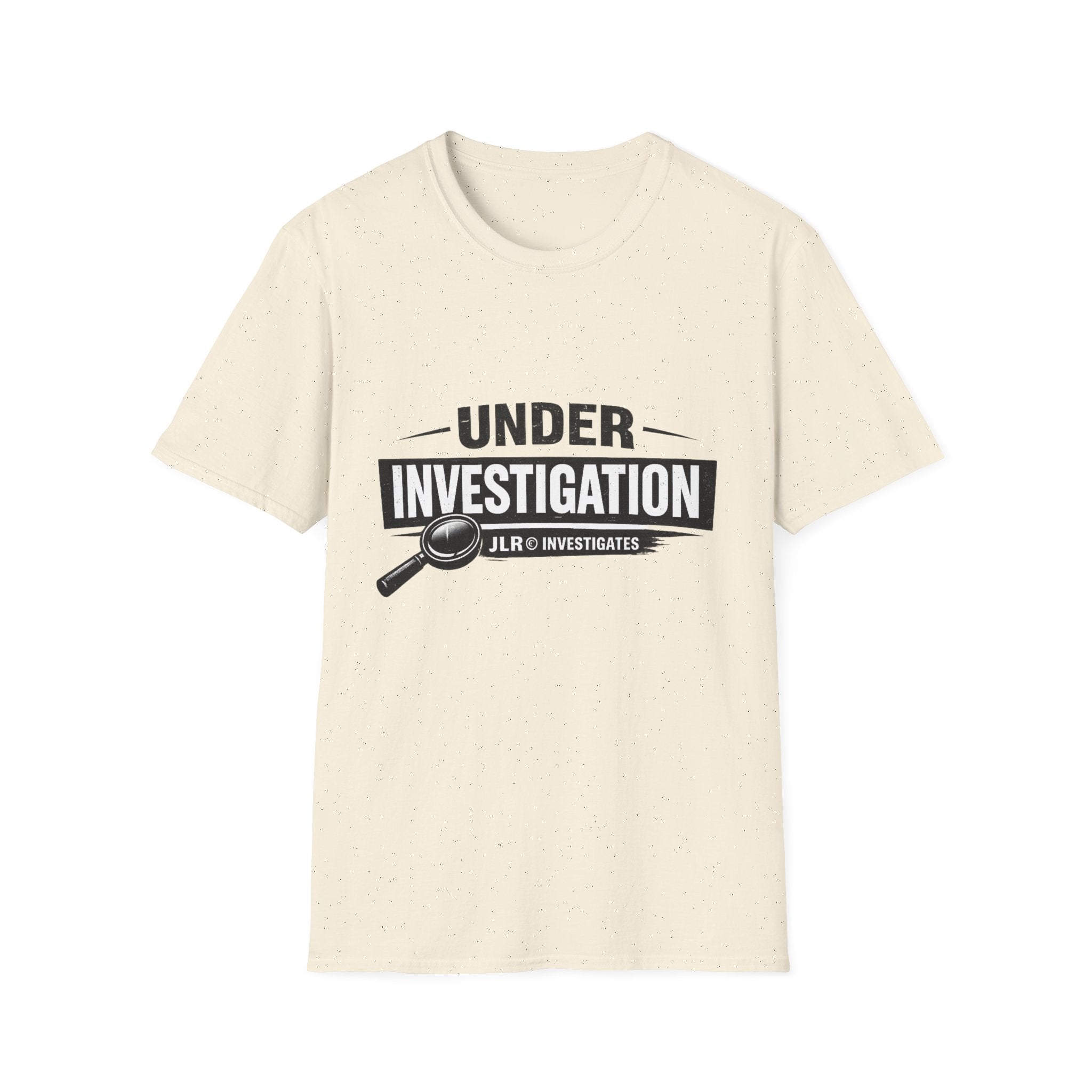 Natural color unisex t-shirt featuring a bold 'Under Investigation — JLR© Investigates' graphic with a magnifying glass icon and black and white banner design