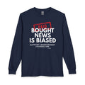 A navy blue long-sleeve t-shirt with a graphic print on the front. The graphic features a red stamp reading 'PAID' over bold white text that says 'BOUGHT NEWS IS BIASED' and smaller white text below reading 'SUPPORT INDEPENDENT JOURNALISM'.