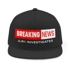 Black snapback hat showing the back panel and "Breaking News" JLR® Investigates logo on the front, rear three-quarter view