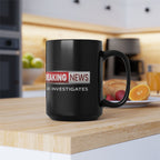 Black mug with 'Breaking News' and 'JLR INVESTIGATES' text on a kitchen counter.