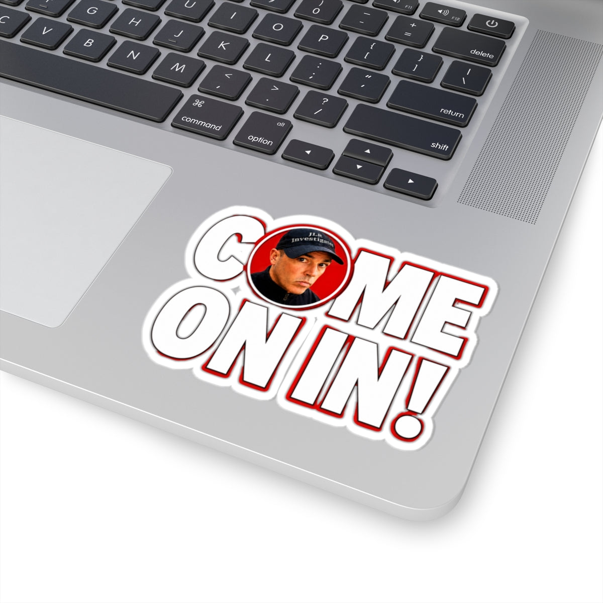 Come On In! sticker displayed on a laptop keyboard, showing full design with red and white lettering