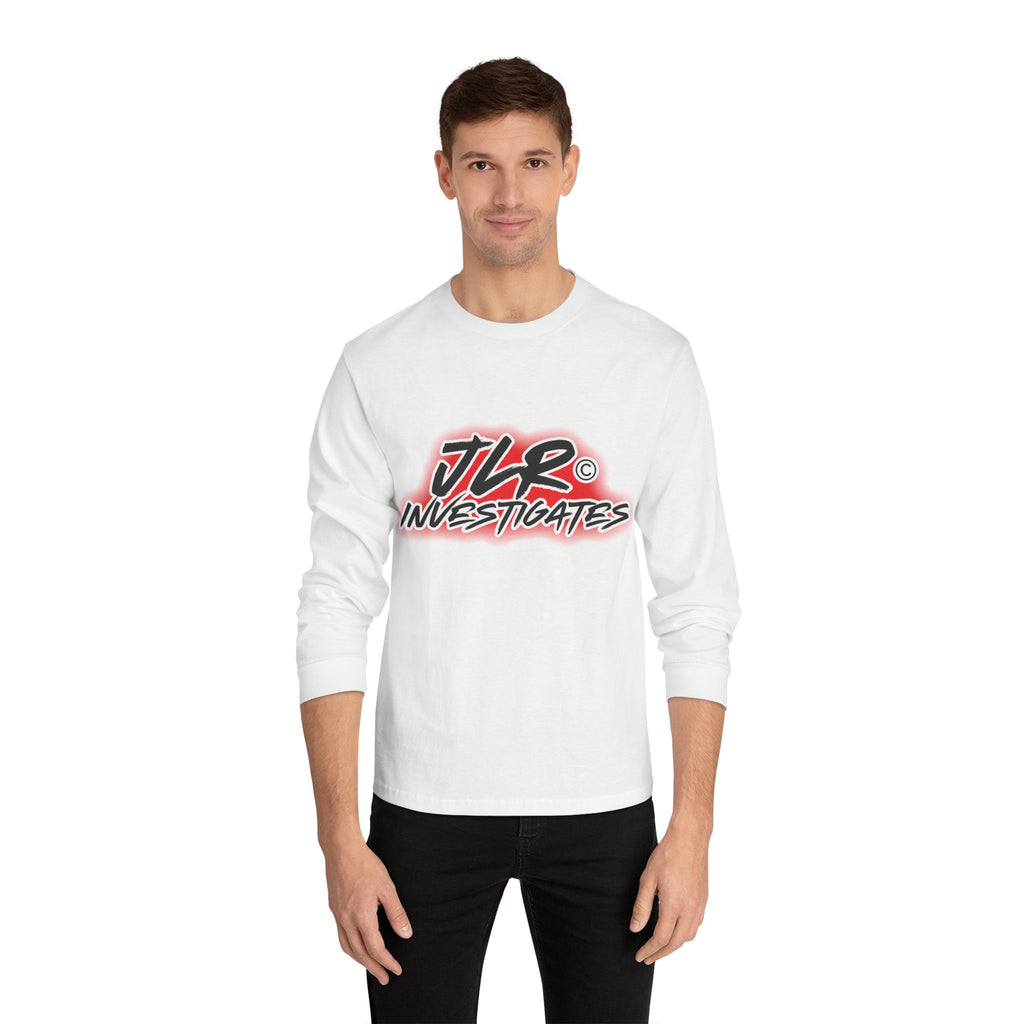 Man wearing White long sleeve unisex t-shirt featuring bold 'JLR© Investigates' graffiti-style logo in red, white, and black