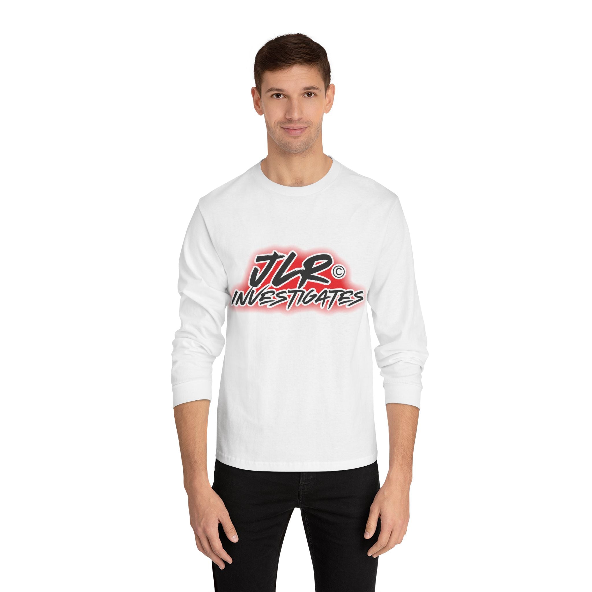 Man wearing White long sleeve unisex t-shirt featuring bold 'JLR© Investigates' graffiti-style logo in red, white, and black