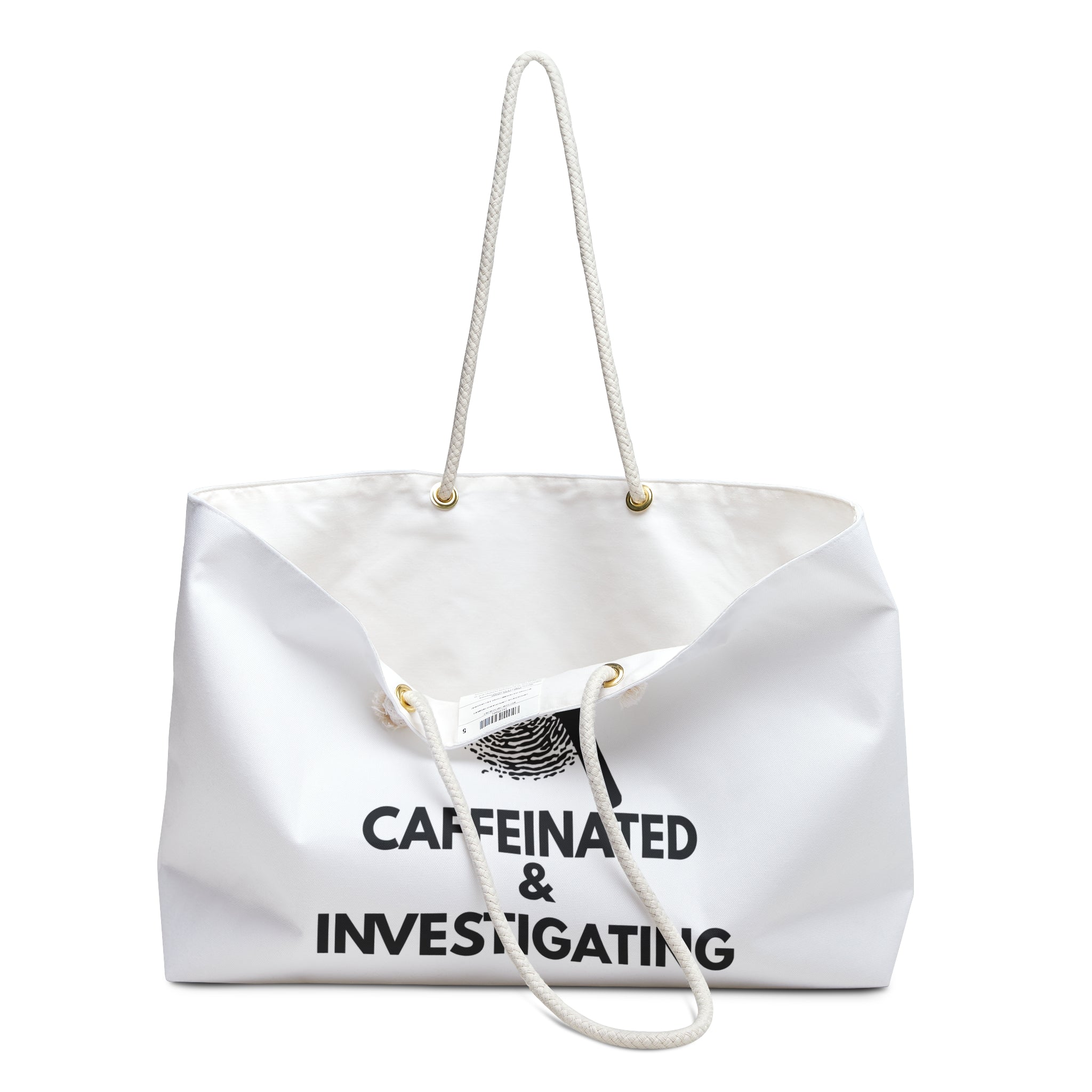 Angled front view of the Caffeinated & Investigating Weekender Bag displaying bold investigator-themed typography and magnifying glass design on white spun polyester