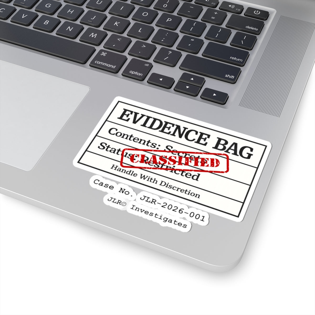 Evidence Bag sticker applied to a laptop keyboard — JLR© Investigates investigator vinyl decal