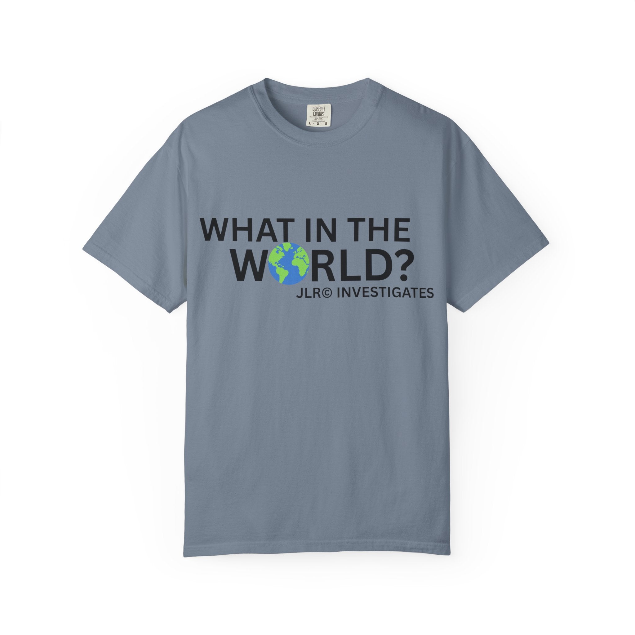 Blue unisex t-shirt featuring bold black text 'What in the World?' with a globe replacing the 'O' and 'JLR© Investigates' subtext below