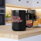 JLR Investigates branded 15oz black ceramic mug with bold red and white logo on kitchen counter— JLR Investigates