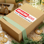 Breaking News JLR© Investigates sticker on a gift box with festive holiday decorations in the background