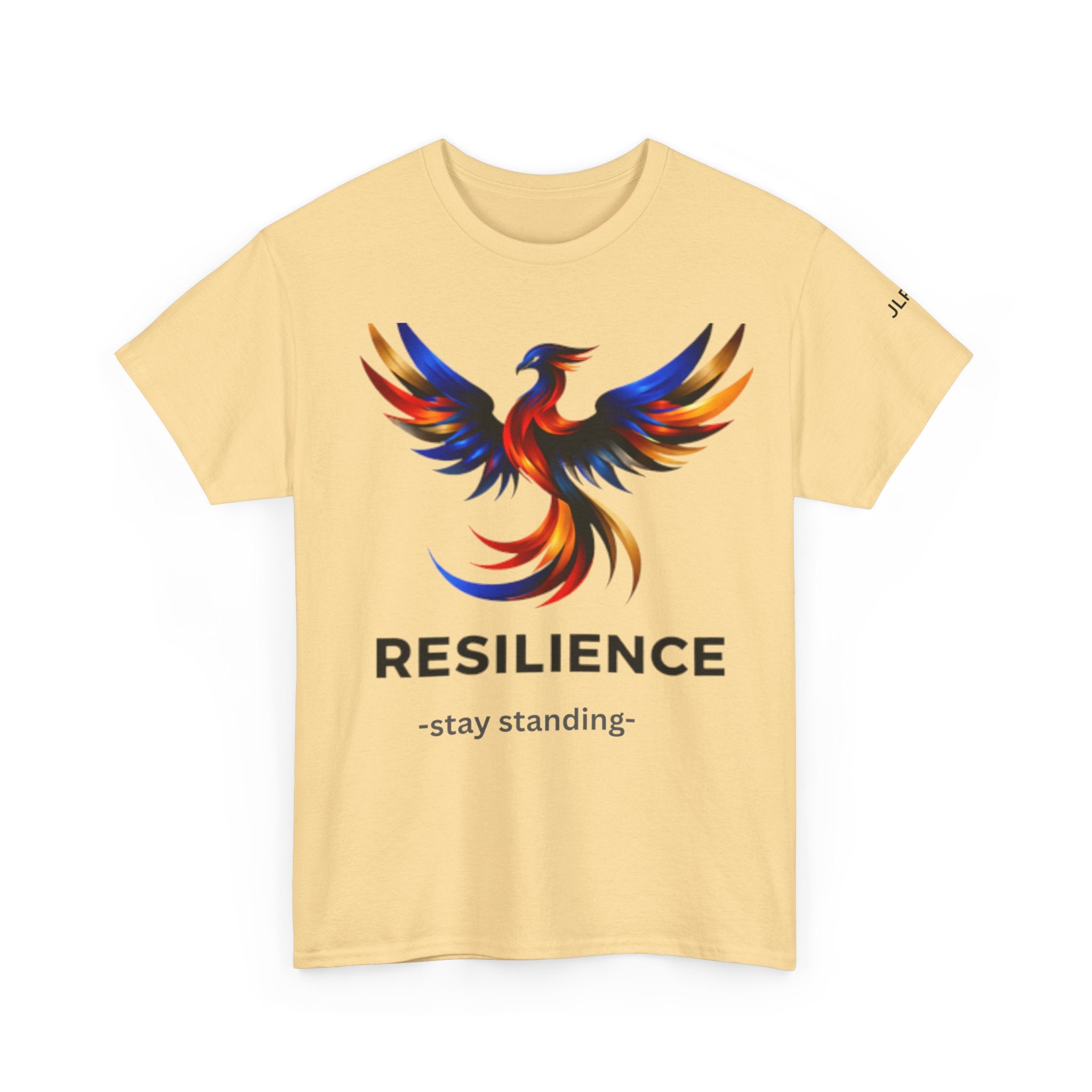 Light yellow unisex t-shirt featuring a bold multicolor phoenix rising graphic with the word RESILIENCE and tagline 'Stay Standing' — JLR Investigates apparel