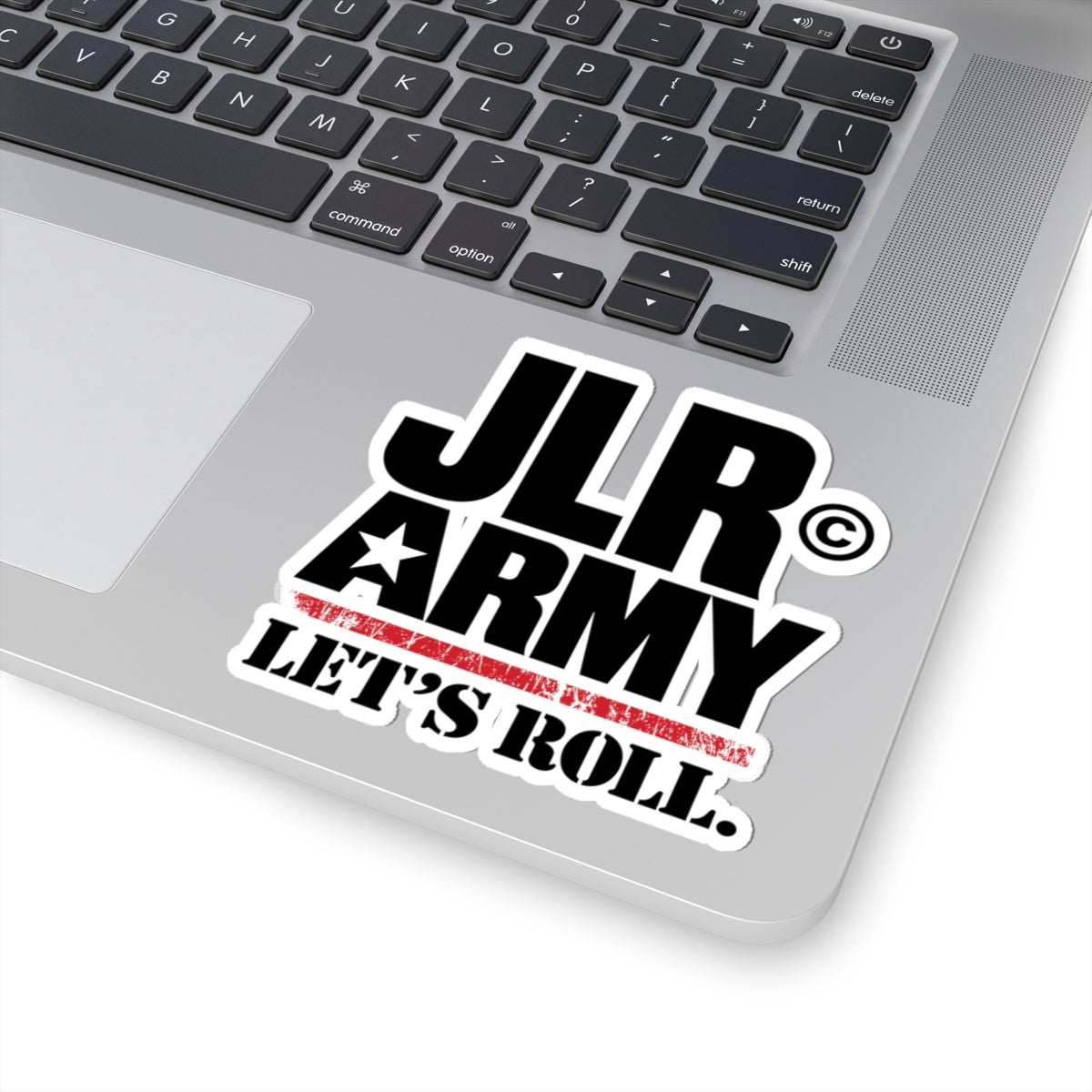 4 × 4 inch JLR© Army “LET’S ROLL.” vinyl sticker with white border on a silver laptop.