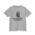 Investigator in Training Kids T-Shirt in Sport Grey with bold fingerprint and magnifying glass design and "INVESTIGATOR IN TRAINING" text on youth short sleeve tee