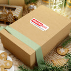Breaking News JLR© Investigates sticker on a cardboard shipping box surrounded by holiday greenery and ornaments