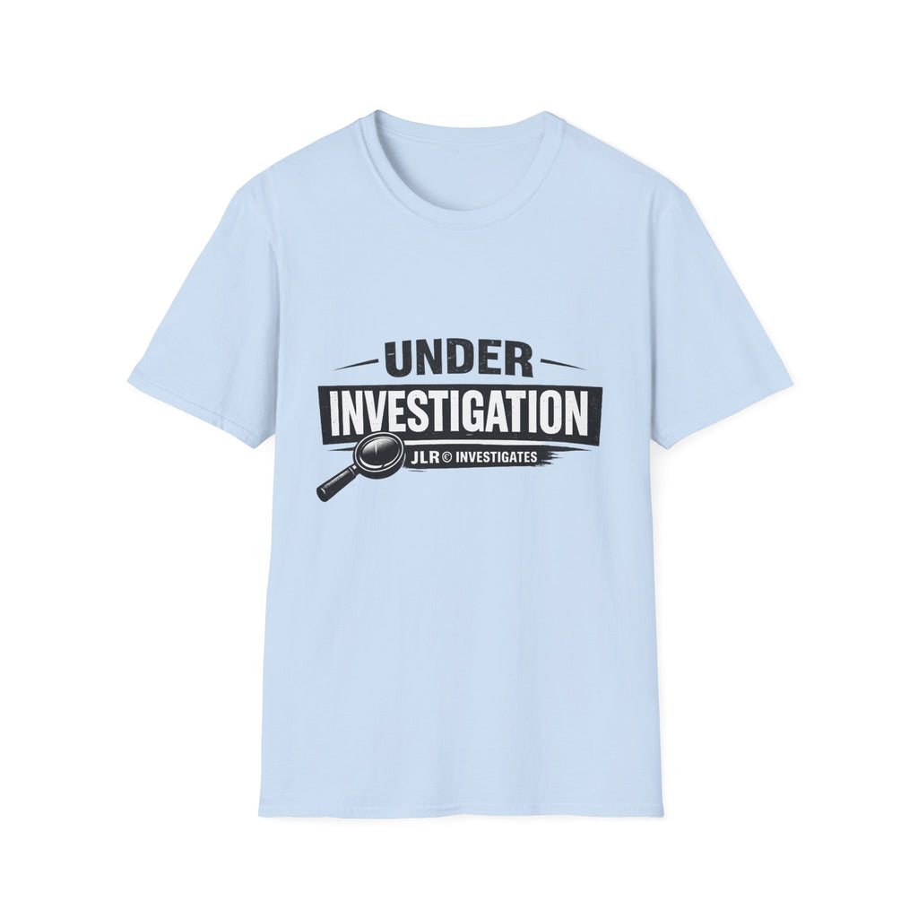 Light blue unisex t-shirt featuring a bold 'Under Investigation — JLR© Investigates' graphic with a magnifying glass icon and black and white banner design