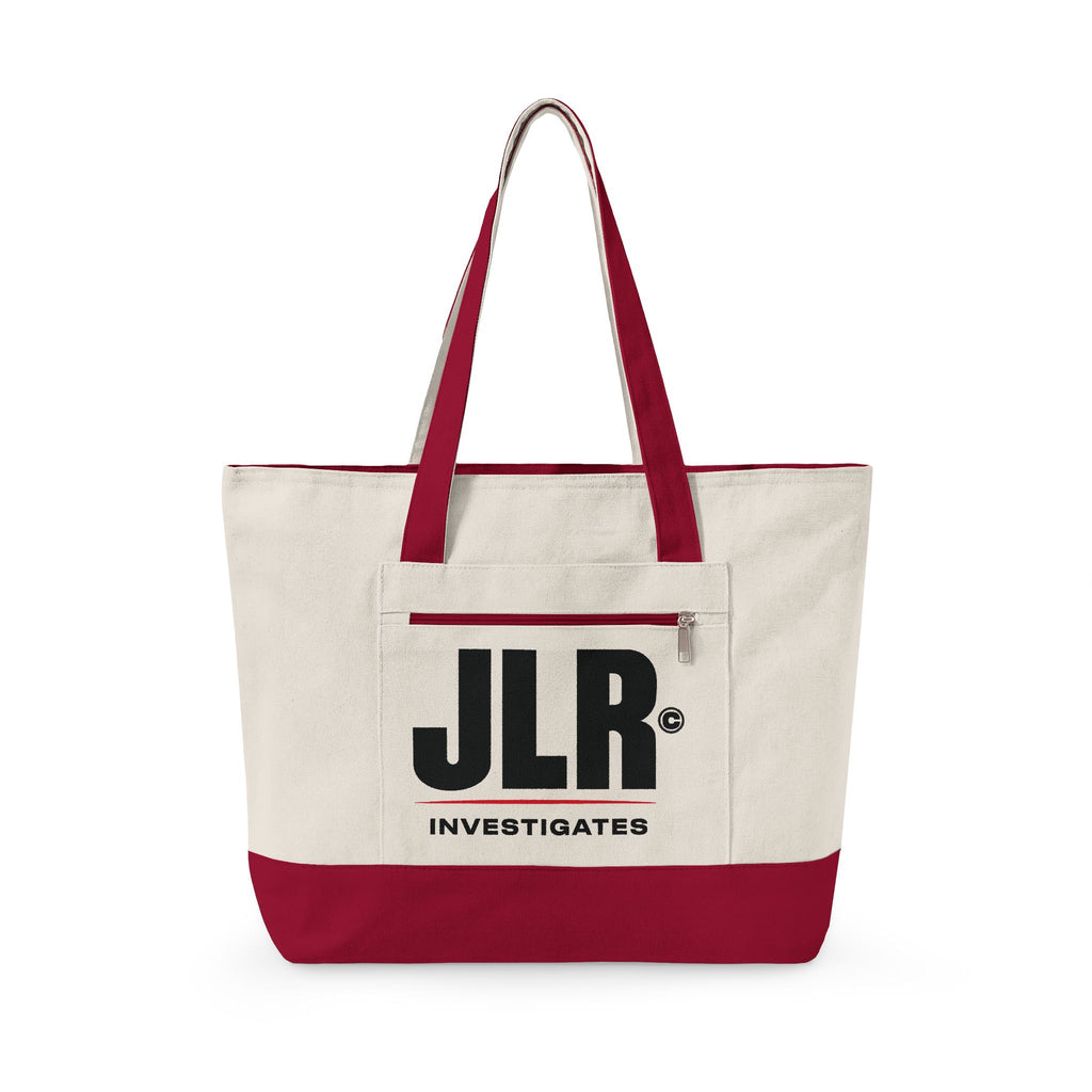 An off-white canvas tote bag with a dark red bottom panel and matching dark red handles, featuring a front pocket with a black 'JLR INVESTIGATES' logo, on a white background.