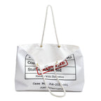 Flat lay of the Evidence Weekender Bag showing full front label design with EVIDENCE BAG text, CLASSIFIED stamp, and JLR© Investigates branding