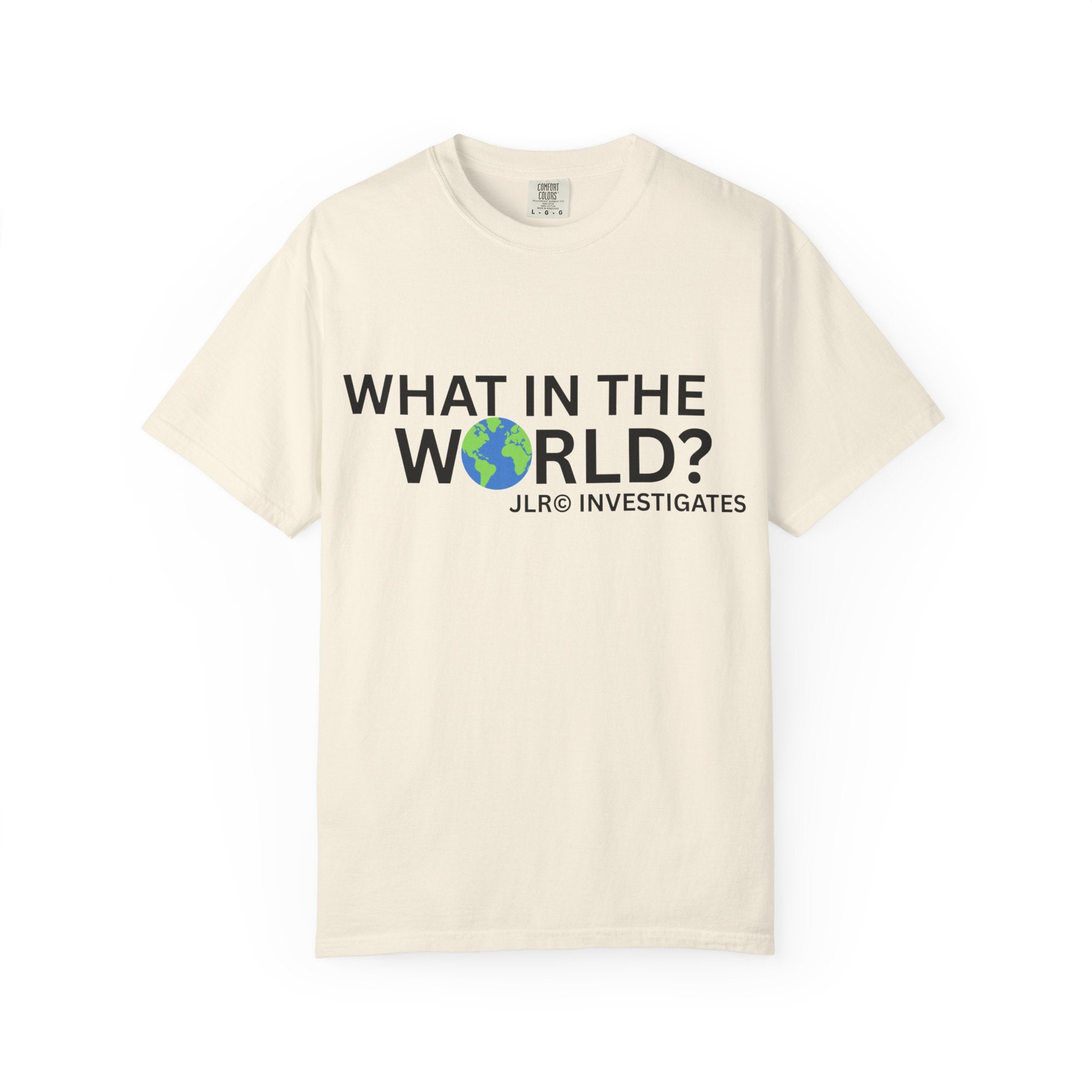 Ivory unisex t-shirt featuring bold black text 'What in the World?' with a globe replacing the 'O' and 'JLR© Investigates' subtext below