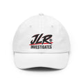White JLR© Bold Logo Dad Cap with a high-contrast black JLR© Investigates design.