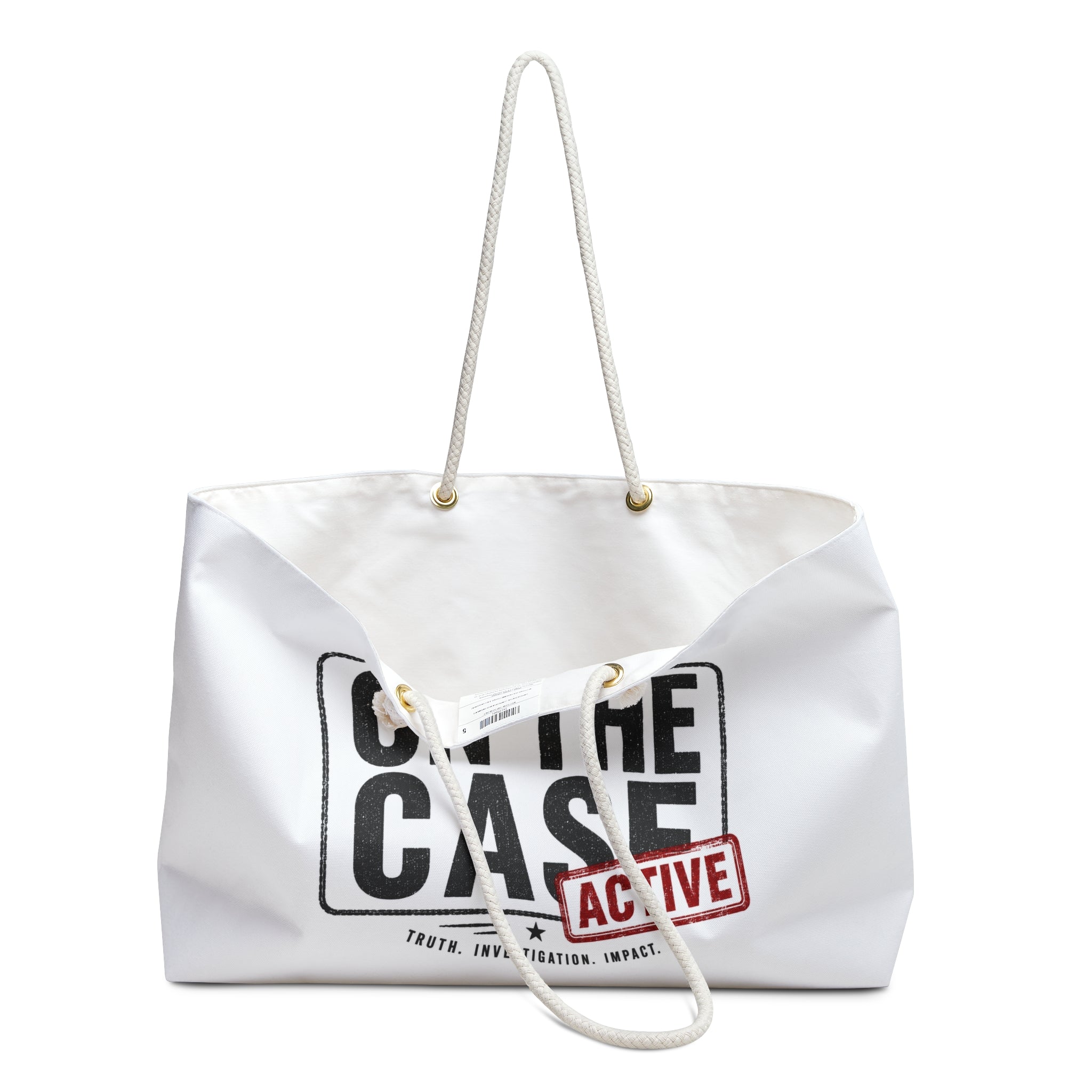 A white canvas tote bag with white rope handles, featuring a black graphic print that reads 'ON THE CASE' and a red stamp graphic that says 'ACTIVE'.
