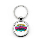 A silver metal round keychain with a printed graphic that reads 'JUST ANOTHER WHACKADOBLE WEDNESDAY!' in colorful comic-style lettering, shown on a plain white background.