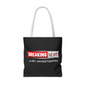 Black tote bag with white handle 'Breaking News' and 'JLR Investigates' text on a white background