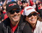 Two people wearing Breaking News! JLR© Investigates Baseball Hats in a crowd