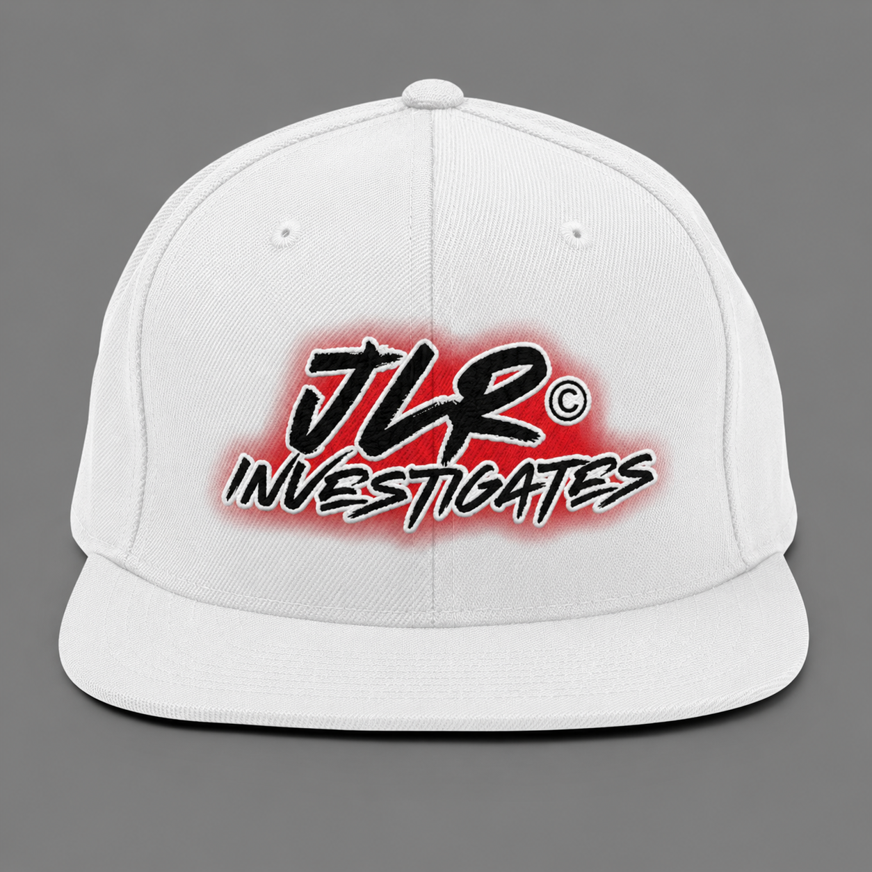 White JLR© Investigates snapback hat with bold red and black logo on front panel, structured crown, flat brim, front view