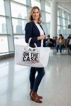 WOMAN IN AIRPORT CARRYING LARGE WHITE WEEKENDER BAG THAT SAYS ON THE CASE