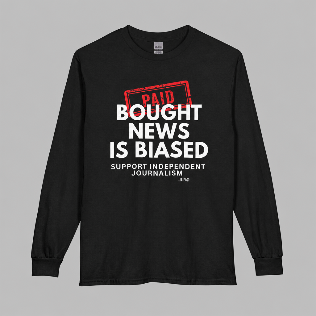 A black long-sleeve t-shirt with a graphic print on the front. The graphic features a red stamp reading 'PAID' above bold white text that reads 'BOUGHT NEWS IS BIASED' and smaller white text below reading 'SUPPORT INDEPENDENT JOURNALISM'.