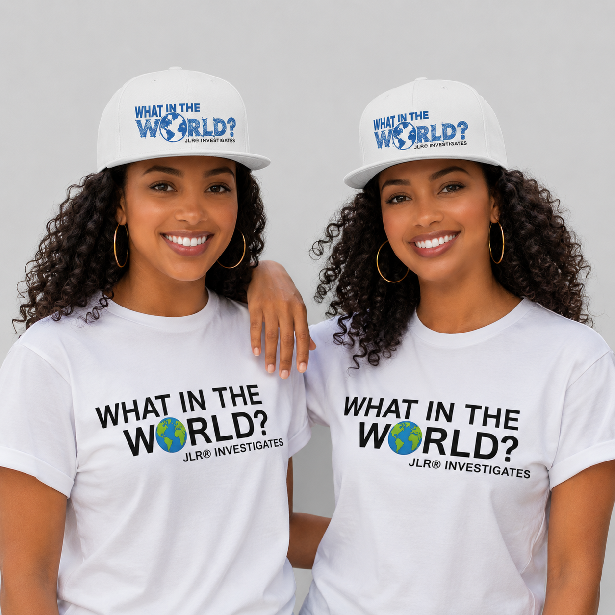 Two women wearing the What in the World? JLR© Investigates Snapback Hat and matching tee in White
