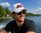 man wearing JLR© Investigates dad cap in white with bold graphic logo at  lake