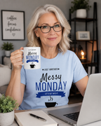 Woman in Messy Monday t-shirt holding the Messy Monday 15oz white ceramic coffee mug at a desk