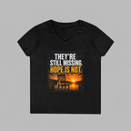 A black women's V-neck t-shirt with a graphic print on the front. The graphic features a sunset over water with an Adirondack chair, and the text 'THEY'RE STILL MISSING.