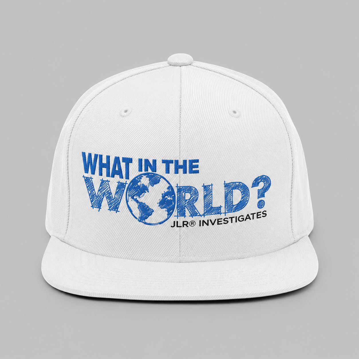 What in the World? JLR© Investigates Unisex Snapback Hat in White with bold blue graphic print on front panel